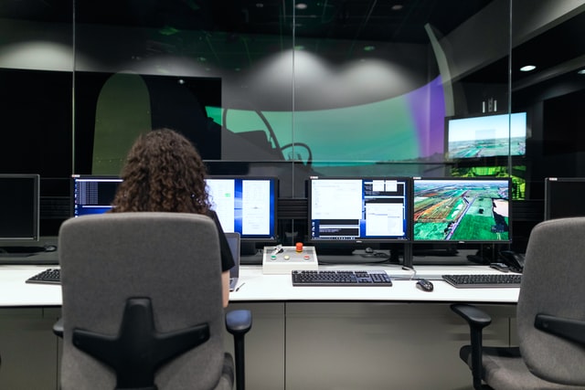 Woman sitting at flight simulator