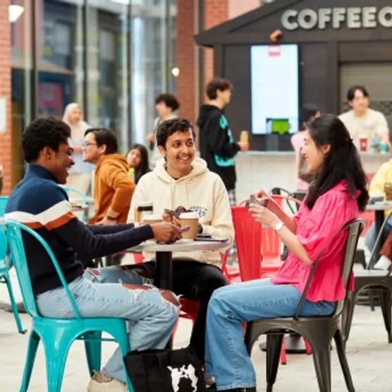 Students chatting in a cafe on the campus