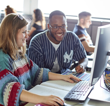 Students working together in a computer lab