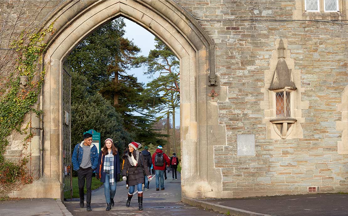 image of students walking under the arch at Singleton Park 