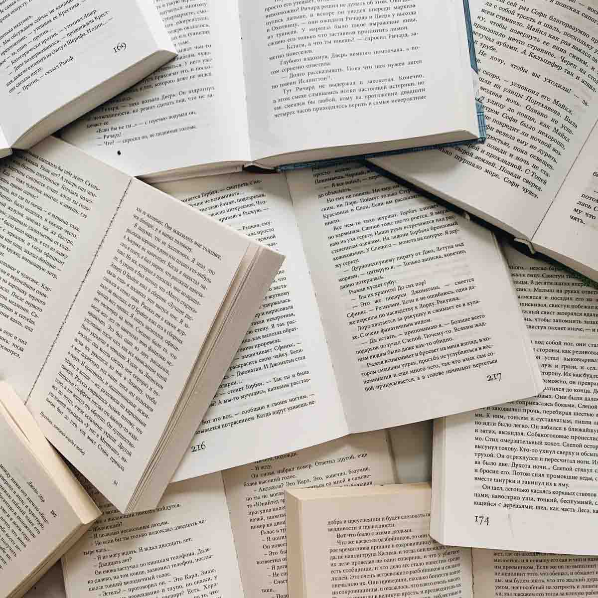 image of students looking at book in library