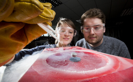 two students delivering experiment 