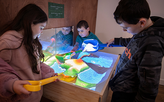 Children looking at an exhibition