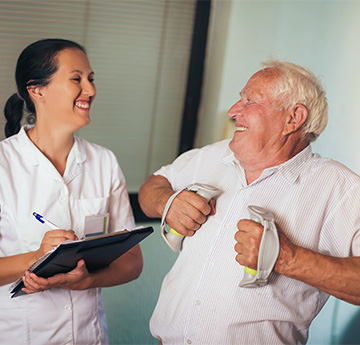 Occupational Therapist with elderly gentleman