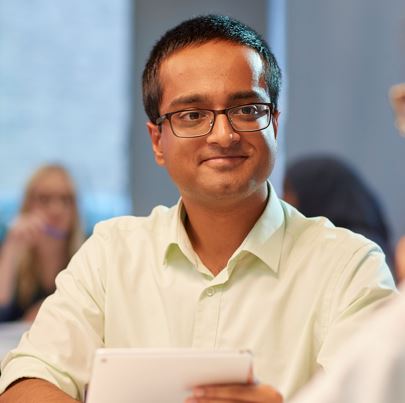 Student sitting in white shirt