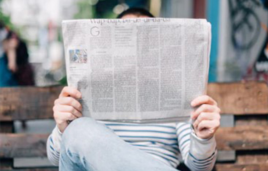 Man reading newspaper