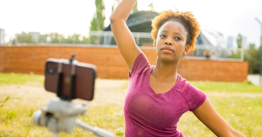 student filming sport