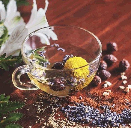 glass teacup with seeds and flowers on table to show the natural ingredients