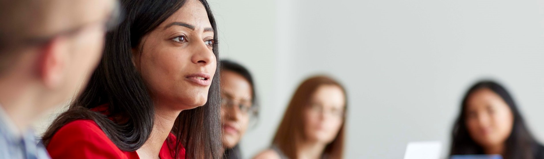 Woman speaking in board room