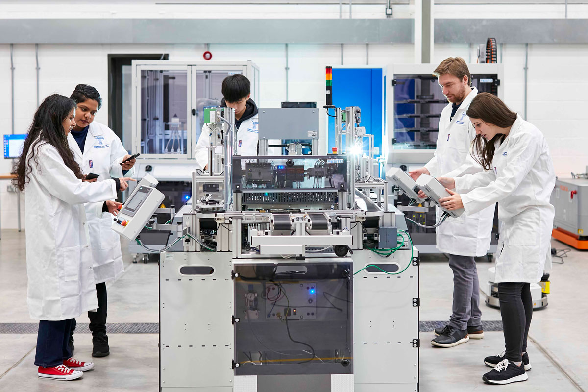 Male and female mechanical engineering students in festo cyber lab