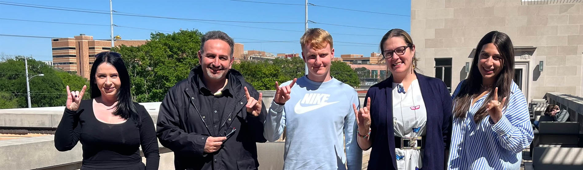 Tom with students and staff