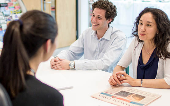 students talking to staff