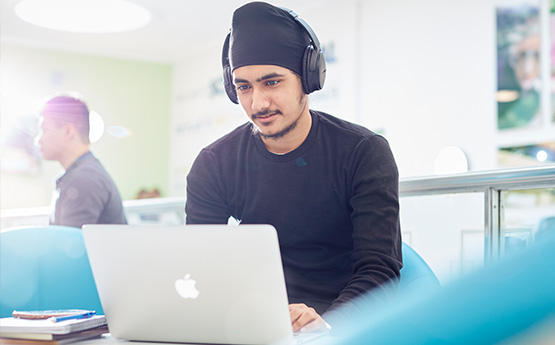 Student looking at a laptop