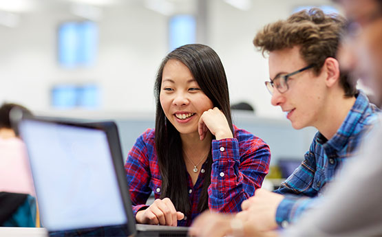 Students looking at a computer