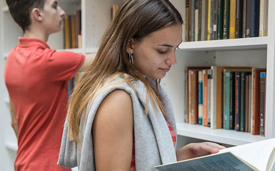 Student looking at a book