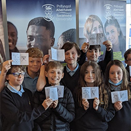 Children in front of banners