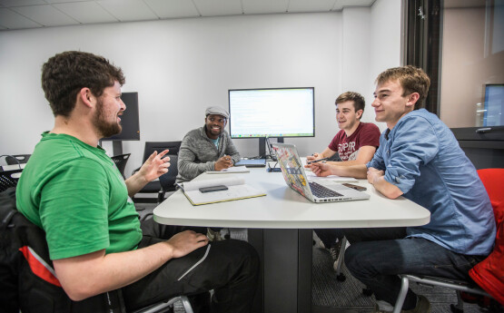 students sitting at a computer