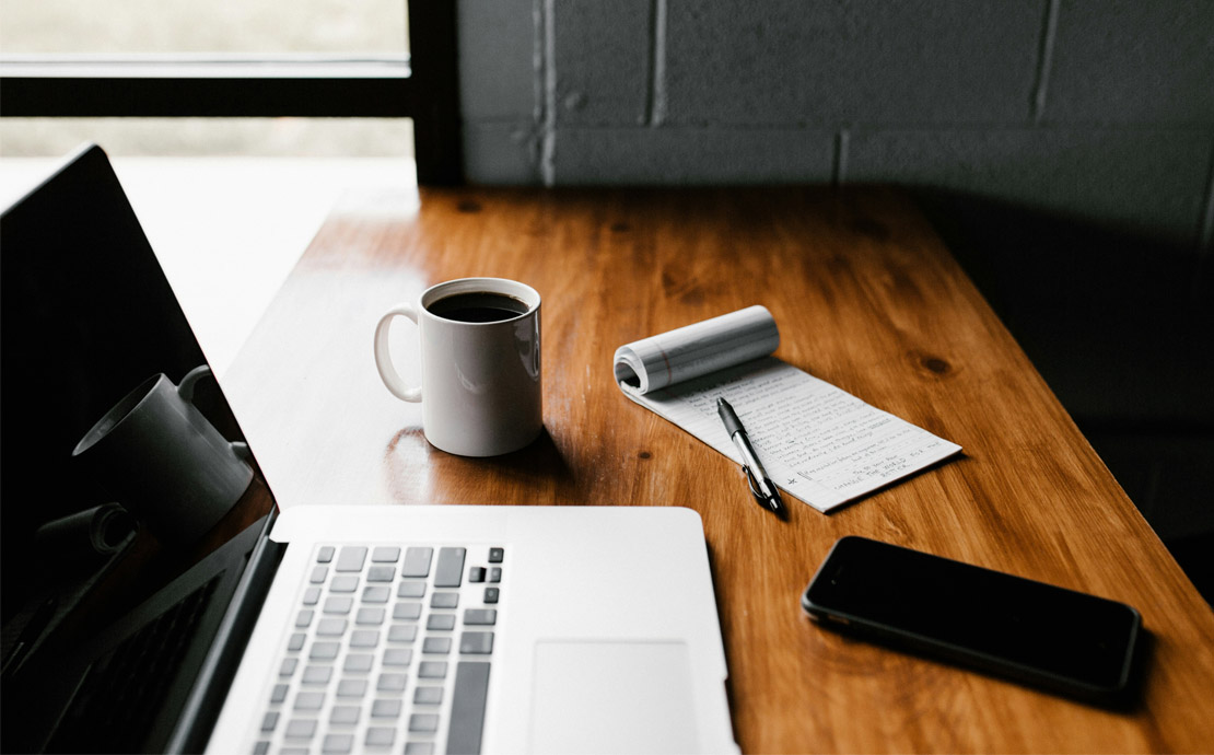 A laptop and a notepad