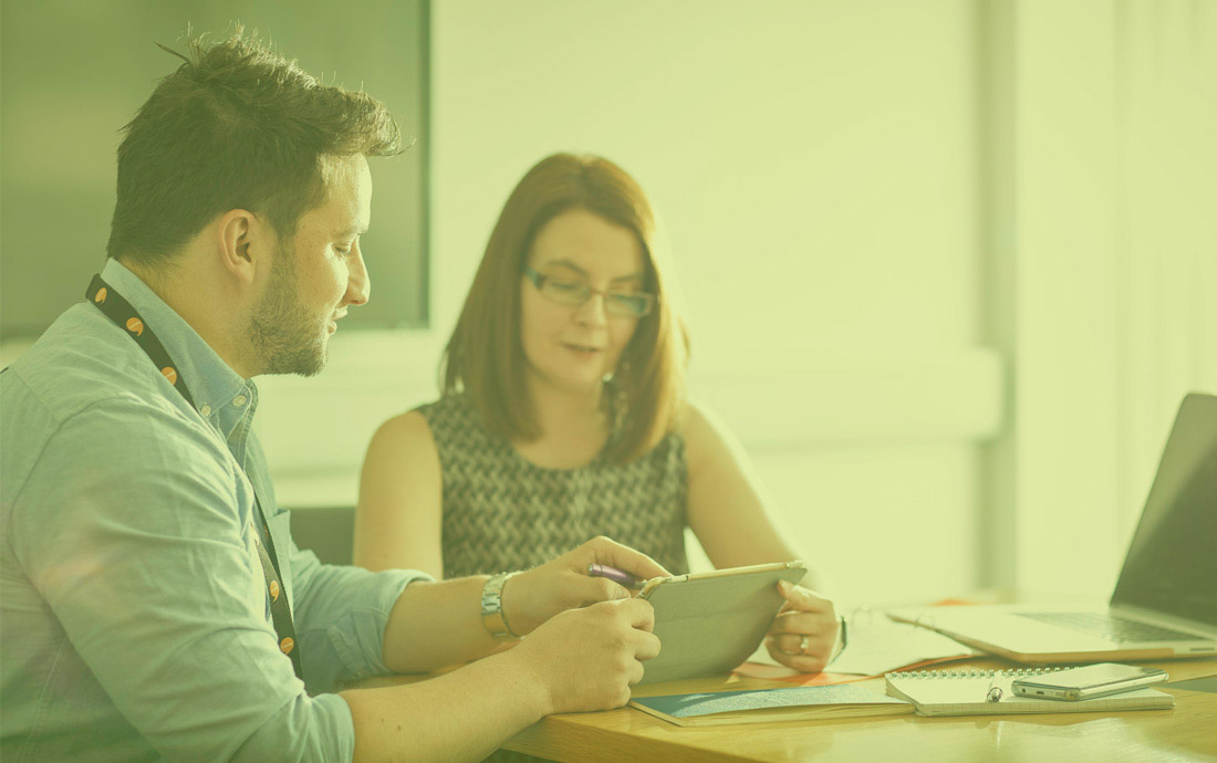 A group of people in a meeting