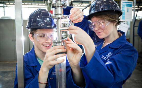 Engineering students conducting an experiment