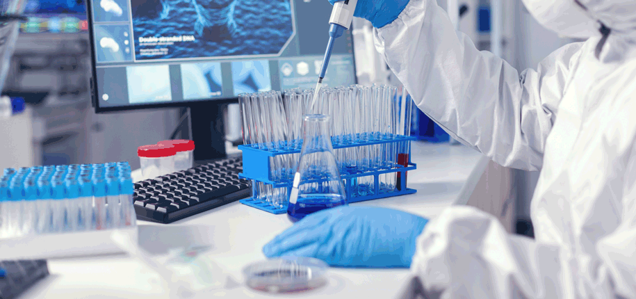 Virolog coducting experiment in modern laboratory doing research using pipette