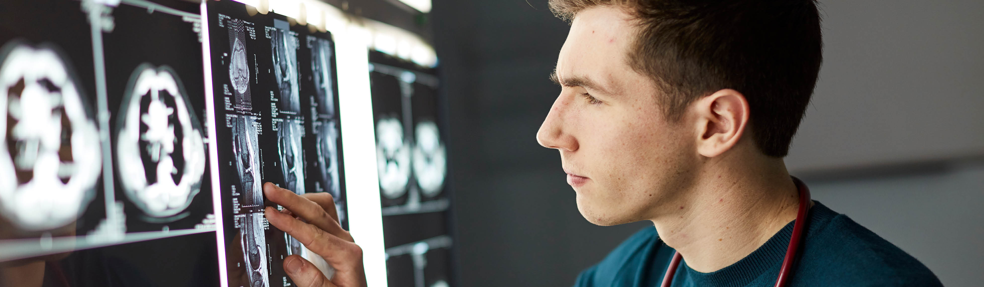 Medical student examining an xray