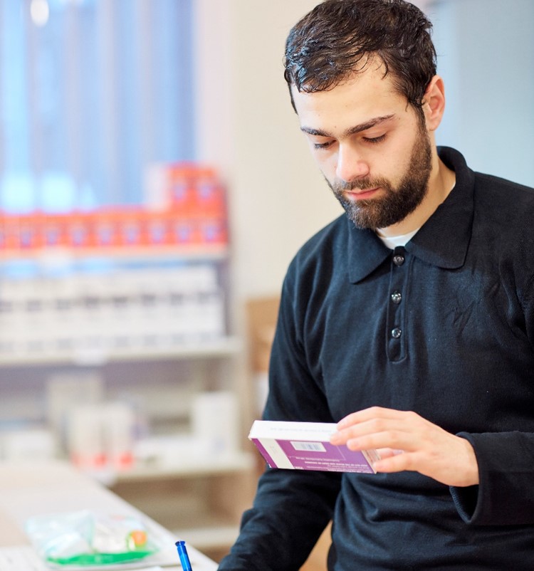 Pharmacist checking medication