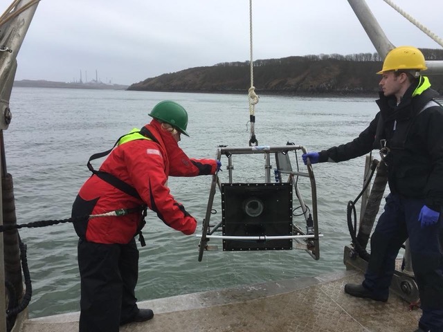 The image shows a clear liquid optical chamber (CLOC) fixed to a baited remote underwater video (BRUV) system.