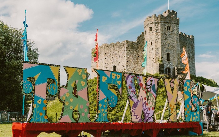 Colourful large lettering spelling Tafwyl outside Cardiff Castle 