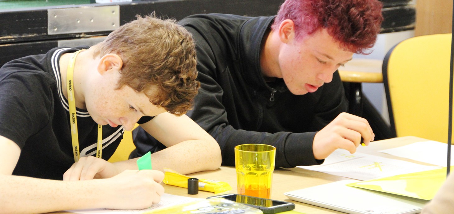 Two pupils working at a Technocamps event, before Covid; new workbooks will allow pupils without internet access to study STEM subjects even if schools are closed