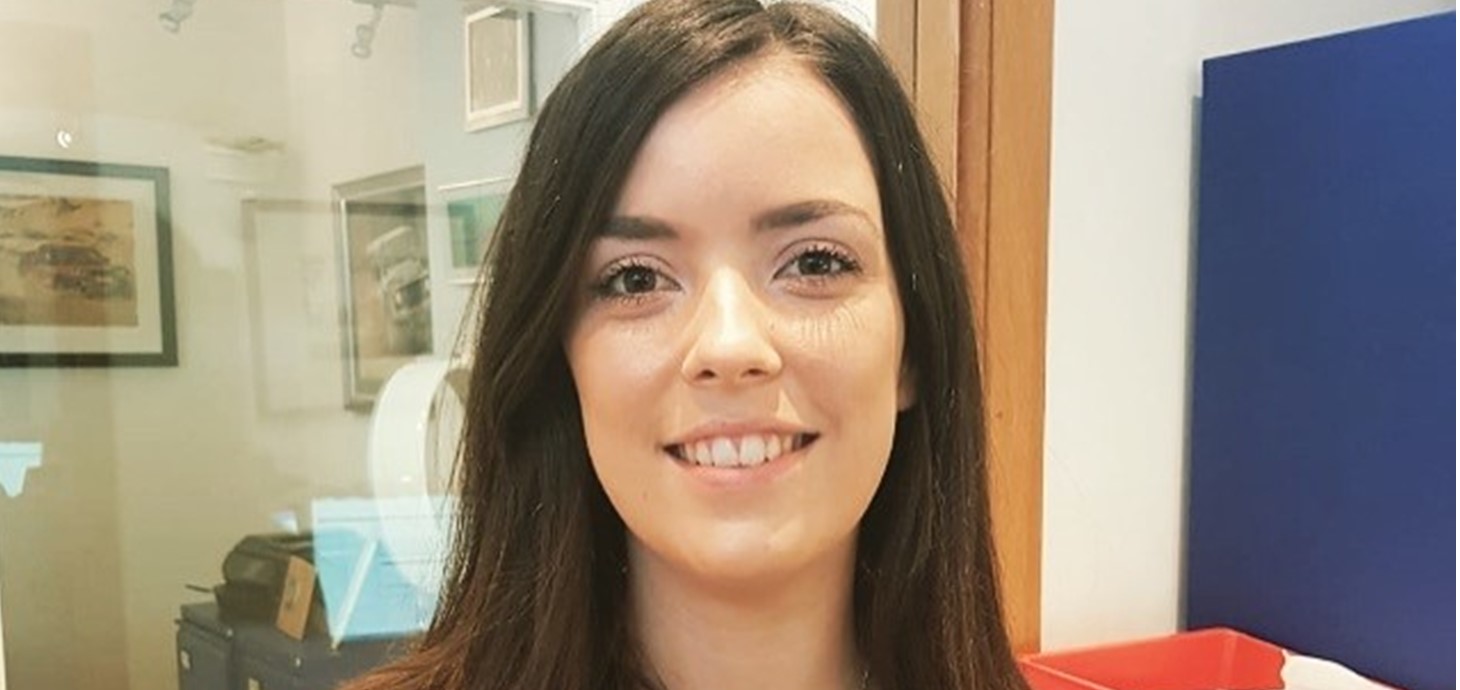 Close up shot of smiling young woman with shoulder length brown hair - Abbie Thomas