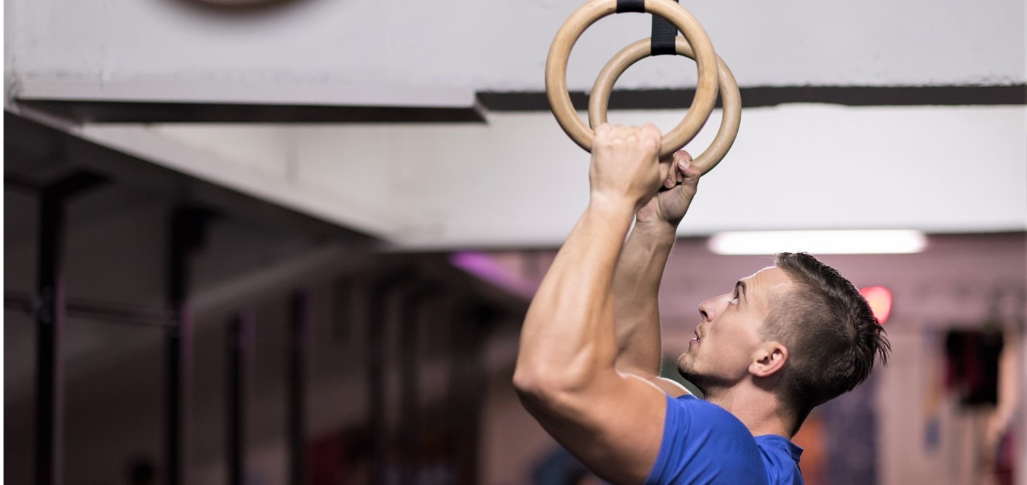 A gymnast on the rings: British athletes in Tokyo, including top medal winners, used wearable technology designed by Swansea University experts, with a printed carbon ink heater to keep their muscles warm before competing.