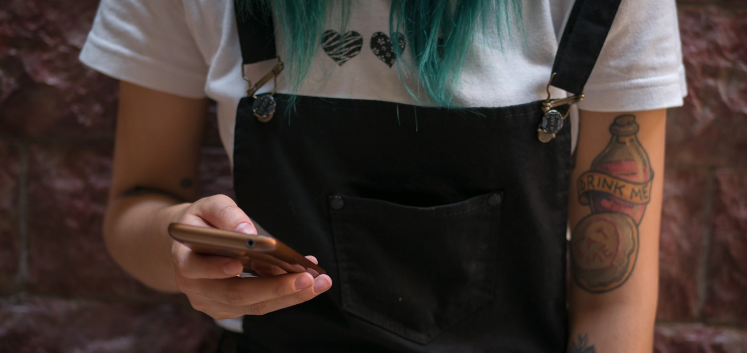 Close-up of young woman using smart phone