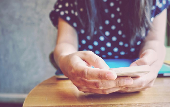 Close-up of a woman using a smart phone.