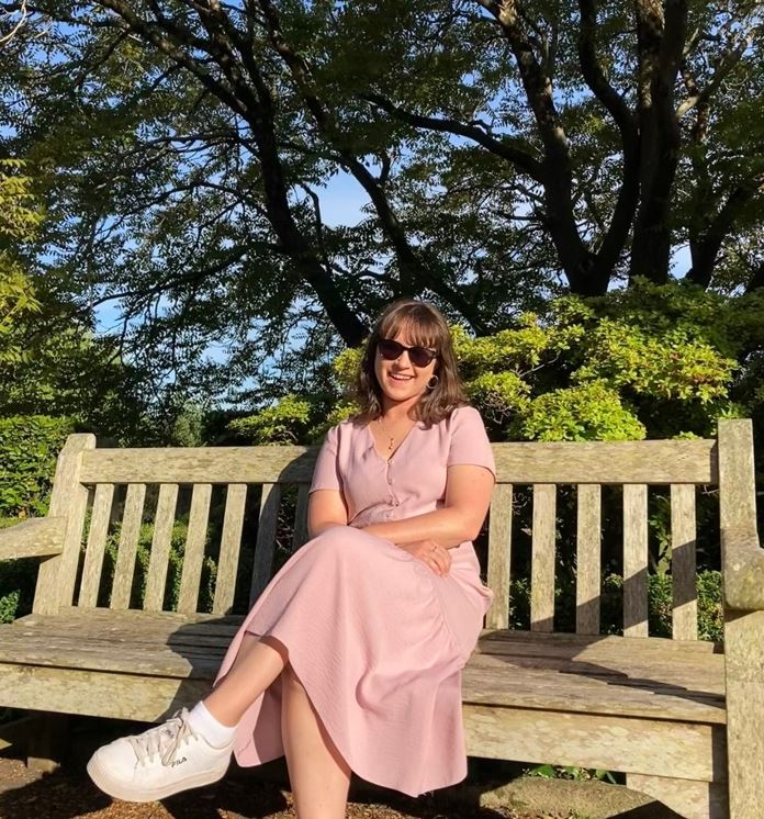 Girl sitting on a park bench