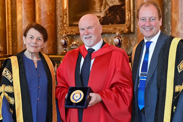 Swansea University Chancellor Dame Jean Thomas, Professor Ronan Lyons and Vice-Chancellor Professor Paul Boyle following the ceremony at Buckingham Palace