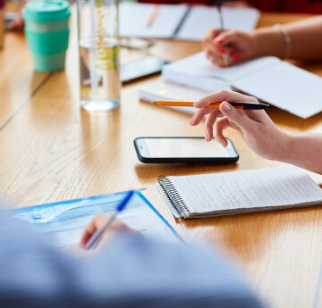 image of people taking notes