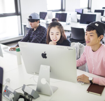 Students looking at computer screen