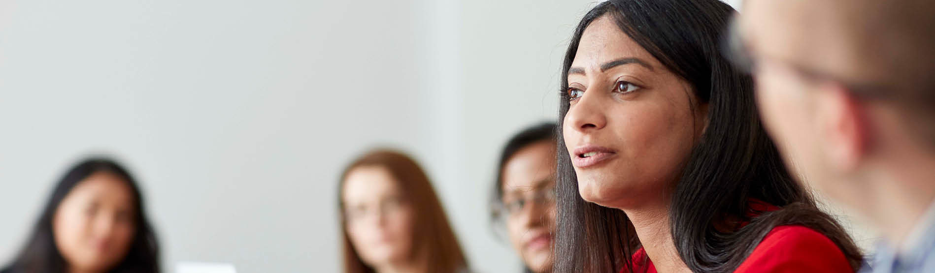 Female talking in boardroom setting