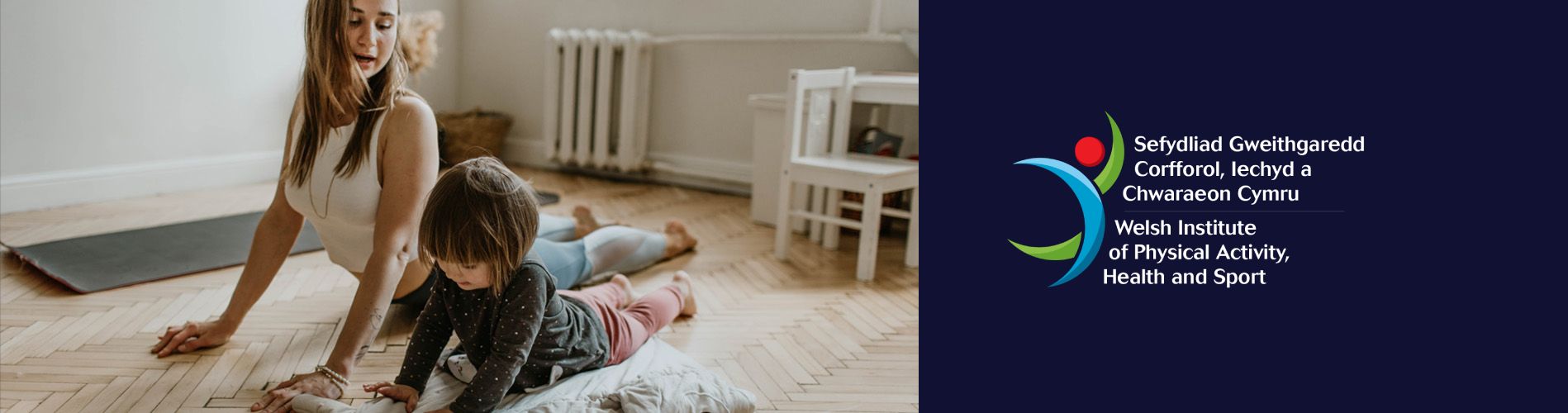 A mum and her daughter practice yoga in the living room. 