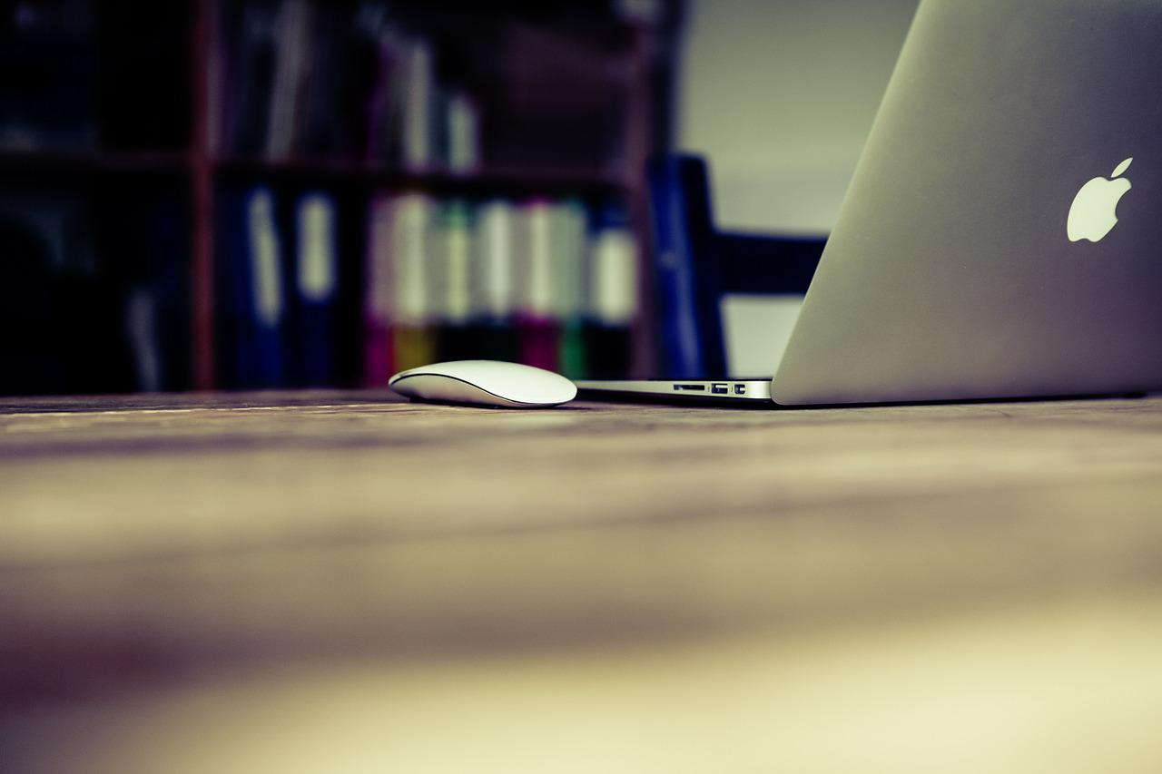 Apple mouse and an laptop