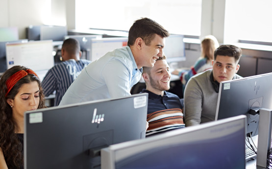 Students working together in the computer lab