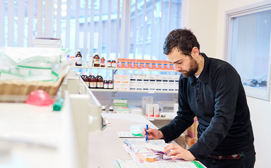 student calculating drugs on a prescription